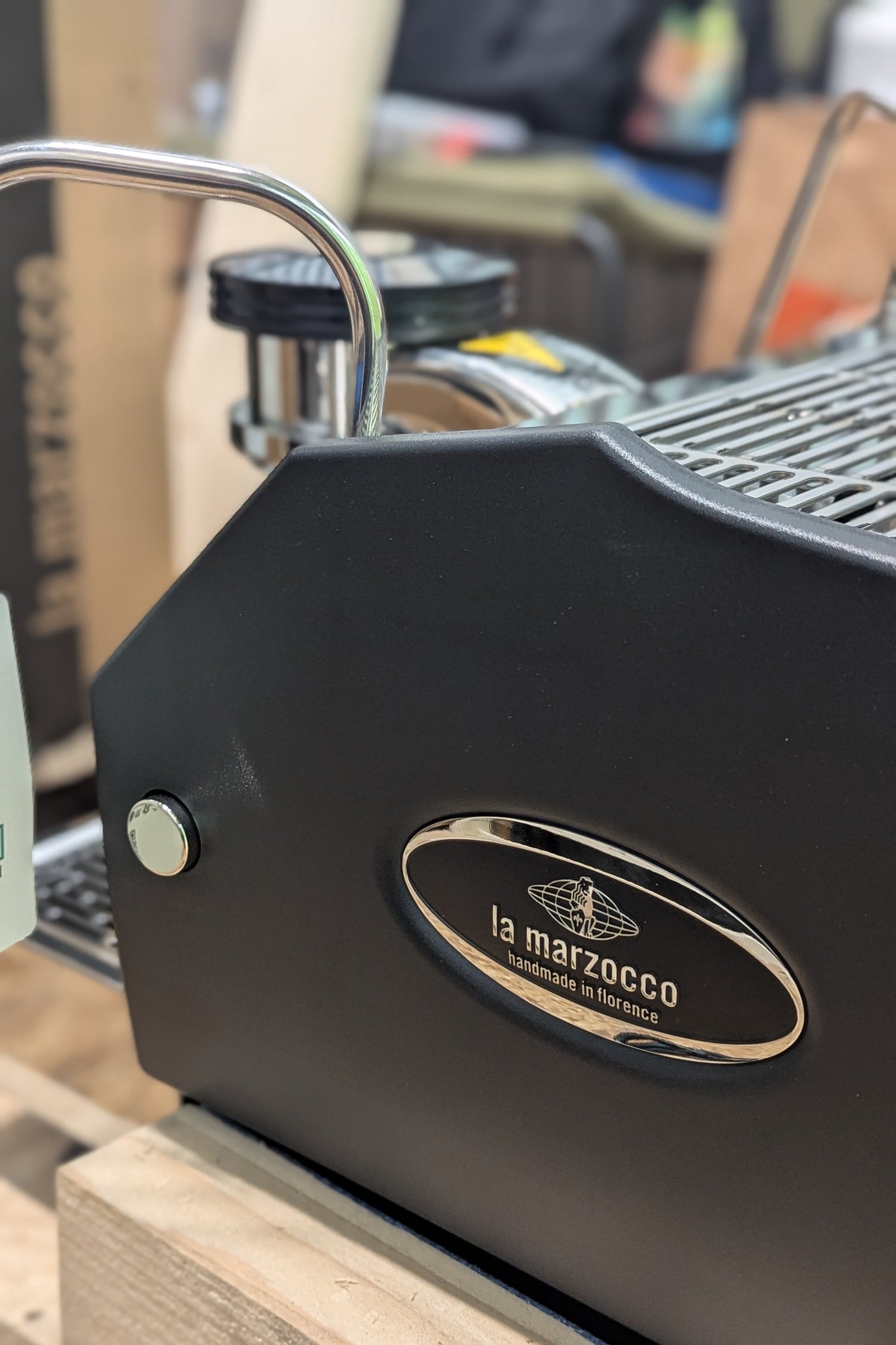 The La Marzocco emblem on the side of a brand new GS3 espresso machine